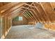 Unfinished attic space, framed with exposed rafters and OSB subflooring, offering potential for expansion at 220 Plonk Rd, Dallas, NC 28034