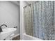 Bathroom with tub, decorative curtain, toilet, and pedestal sink at 220 Plonk Rd, Dallas, NC 28034