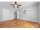 Bedroom featuring wood floors, a ceiling fan, a closet, and a built-in shelf at 220 Plonk Rd, Dallas, NC 28034
