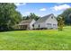 Charming home with a welcoming porch, complemented by an oversized two-car garage at 220 Plonk Rd, Dallas, NC 28034