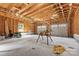 Large garage with unfinished walls and ceiling, two garage doors, and ample workspace at 220 Plonk Rd, Dallas, NC 28034