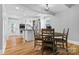 Modern kitchen with white cabinets, island, and stainless steel appliances, adjacent to dining at 220 Plonk Rd, Dallas, NC 28034