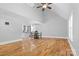 Open-concept living area featuring hardwood floors, high ceilings, and an adjacent kitchen at 220 Plonk Rd, Dallas, NC 28034