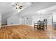 Spacious open-concept living area with hardwood floors, dining area, and kitchen at 220 Plonk Rd, Dallas, NC 28034