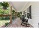 Relaxing front porch featuring rocking chairs and hanging plants, creating a cozy space at 220 Plonk Rd, Dallas, NC 28034
