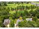 Aerial shot showcasing the landscaped yard and proximity to the golf course at 2241 Flagstick Dr, Matthews, NC 28104