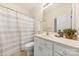 Well-lit bathroom with white vanity, framed mirror, and shower-tub combination at 2241 Flagstick Dr, Matthews, NC 28104