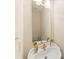 This bathroom features a white sink with gold fixtures, a large mirror, and a decorative soap dispenser at 2241 Flagstick Dr, Matthews, NC 28104