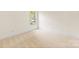 Bright, carpeted bedroom features a large window and neutral color palette at 2241 Flagstick Dr, Matthews, NC 28104