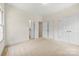 Comfortable bedroom with carpeting, closet space, and bright white trim at 2241 Flagstick Dr, Matthews, NC 28104