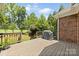 Elevated wooden deck overlooking lush green space at 2241 Flagstick Dr, Matthews, NC 28104