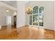 Dining room with hardwood floors, chandelier, and view of the front yard at 2241 Flagstick Dr, Matthews, NC 28104