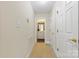 Hallway view featuring a bathroom and multiple doors at 2241 Flagstick Dr, Matthews, NC 28104