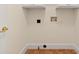 The laundry room includes washer and dryer hookups, with upper cabinets for storage at 2241 Flagstick Dr, Matthews, NC 28104