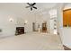 Spacious living room features a fireplace, plush carpeting, and an abundance of natural light at 2241 Flagstick Dr, Matthews, NC 28104