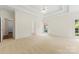 Expansive main bedroom with tray ceiling, neutral carpeting, and abundant natural light from large windows at 2241 Flagstick Dr, Matthews, NC 28104