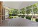 Relaxing screened-in porch offers serene views of the lush backyard and landscaping at 2241 Flagstick Dr, Matthews, NC 28104