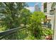 A nice balcony with views of a green park and city skyline at 229 N Church St # 401, Charlotte, NC 28202