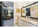 Bathroom with double vanity, granite countertop, and framed mirrors at 229 N Church St # 401, Charlotte, NC 28202