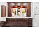 Bathroom features a double vanity with marble countertops, dark wood cabinets, and stylish lighting fixtures at 229 N Church St # 401, Charlotte, NC 28202