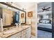 Bathroom with double vanity, granite countertop, and framed mirrors at 229 N Church St # 401, Charlotte, NC 28202