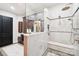 Bathroom features a marble shower, tile flooring, and a bench seat at 229 N Church St # 401, Charlotte, NC 28202