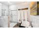 This bathroom features a luxurious soaking tub, multiple shower heads, and marble finishes at 229 N Church St # 401, Charlotte, NC 28202
