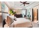 Serene bedroom featuring a tray ceiling and ample natural light at 229 N Church St # 401, Charlotte, NC 28202