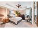 Serene bedroom featuring a tray ceiling, neutral tones, and ample natural light at 229 N Church St # 401, Charlotte, NC 28202