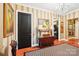 Hallway with striped walls, chandelier, and art pieces at 229 N Church St # 401, Charlotte, NC 28202
