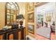 Elegant hallway adorned with classic artwork, mirror, and beautiful decor at 229 N Church St # 401, Charlotte, NC 28202