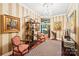 Beautiful hallway with striped walls, chandelier, art and stylish furnishings at 229 N Church St # 401, Charlotte, NC 28202