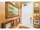 A well-decorated hallway featuring art and a white entry door at 229 N Church St # 401, Charlotte, NC 28202