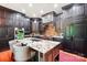 Modern kitchen with stainless steel appliances, granite countertops, large island, and custom cabinets at 229 N Church St # 401, Charlotte, NC 28202