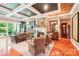 Elegant living room featuring coffered ceilings, fireplace, hardwood floors, and refined furnishings at 229 N Church St # 401, Charlotte, NC 28202