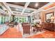 Spacious living room boasting a fireplace, grand piano, coffered ceiling, and floor-to-ceiling windows at 229 N Church St # 401, Charlotte, NC 28202