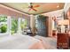 This main bedroom offers a balcony overlooking the trees and an attached room through an arched doorway at 229 N Church St # 401, Charlotte, NC 28202
