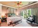 Spacious main bedroom with large bed, seating area, balcony, and plenty of natural light at 229 N Church St # 401, Charlotte, NC 28202