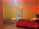Bedroom with red bedspread and window covered with a sheet at 238 Deaton St, Statesville, NC 28677