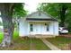 Charming one-story home with a classic design, complemented by a well-maintained front yard and mature trees at 238 Deaton St, Statesville, NC 28677