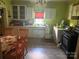 Kitchen with cabinets and washer dryer at 238 Deaton St, Statesville, NC 28677