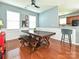 Dining area showcases a wooden table with benches, seamlessly connecting to the kitchen at 3009 Canopy Dr, Indian Trail, NC 28079