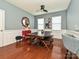 Bright dining room with wainscoting, wooden table with bench seating, and modern decor at 3009 Canopy Dr, Indian Trail, NC 28079
