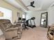 Multi-purpose room used as a home office/gym; featuring treadmill, desk and a relaxing recliner at 3009 Canopy Dr, Indian Trail, NC 28079