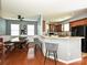 Open-concept kitchen featuring granite countertops, barstool seating, and stainless steel appliances at 3009 Canopy Dr, Indian Trail, NC 28079