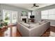 Comfortable living room with fireplace, sectional sofa, and bright natural light at 3009 Canopy Dr, Indian Trail, NC 28079