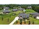 Aerial view of a suburban home featuring a well-kept yard and a pool in a neighborhood setting at 3256 Fairmead Dr, Concord, NC 28025