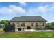 Spacious backyard with a patio, lounge area, and lush green lawn at 3256 Fairmead Dr, Concord, NC 28025