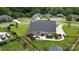Aerial view of a private backyard featuring a patio, fence, and manicured lawn at 3256 Fairmead Dr, Concord, NC 28025