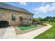 Well-maintained backyard featuring an outdoor swing and barbecue area at 3256 Fairmead Dr, Concord, NC 28025